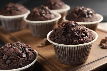 Tuinposter Delicious chocolate muffins on table, closeup view © New Africa