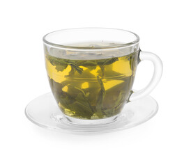 Fresh green tea in glass cup, leaves and saucer isolated on white