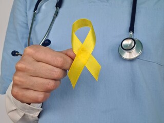Symbolic color of yellow ribbon for sarcoma bone cancer and bladder health and liver disease