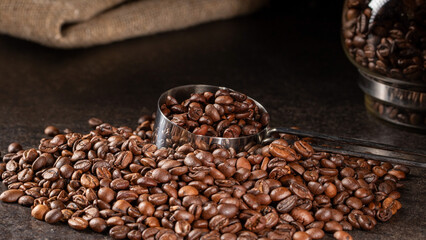 Dark and rustic roasted coffee beans - low key still life photography