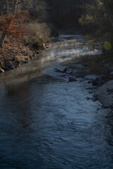 Stream with fog rising