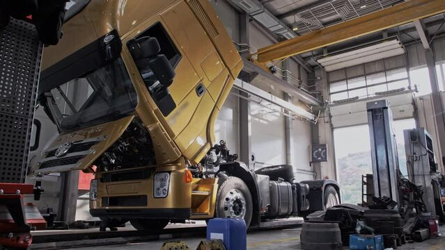 Automated lowering of the cab of a new freight truck at the factory 