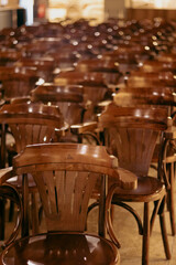 wooden chairs lined up in the interior