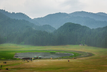 Panoramic view of famous tourist destination Khajjiar, It is green meadow with lake nestled down in...