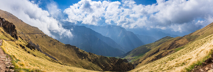 Mesmerizing view en-route to Roopkund trekking trail of Ali Bedni bugyal or meadows. Roopkund is a...