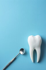 Vertical image of a blue postcard with a white fake tooth, concept of dentistry, dental care and international dentist day celebration
