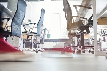 View to bright and spacious meeting room with office chairs and desks