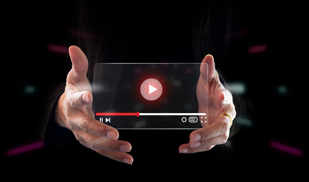 Live video marketing concept. Businessman hand holding transparent screen and tuching on start button to run video clip.