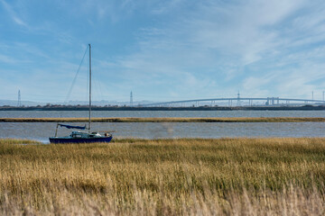 View across the River Medway near Upchurch in Kent, England. The swale bridge can also be seen in...