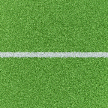 Chalk line on a groomed grass field. Base image for composites for soccer or football sports images. High angle view.