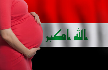 Pregnant woman belly on flag of Iraq background