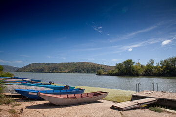 Panorama of the danube river and the beginning of the iron gats with wooden fishing boats in...