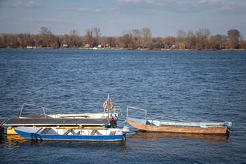 Picture of small boats on a quay of Zemun, Serbia, during a sunny afternoon, used by fishermen to fish on the danube.