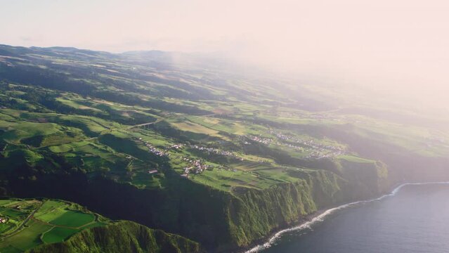Aerial shot, drone point of view rocky coastline, Atlantic Ocean coastline of Island of Sao Miguel, Azores, Portugal. Travel destinations and beauty in nature concept