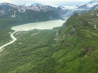 Glacier flows into Glacial Lake at Lake Clark National Park in Alaska. Double Glacier is Lake Clark National Park's largest glacier. Aerial view of South Fork Big River flowing out of glacial lake.