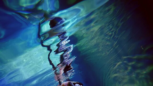 The female underwater dance has an indescribable grace and sophistication, like a mermaid in her water symphony, embodying the beauty and eternity of underwater art.