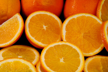 Sliced ​​orange slices shot in macro photography on a black background