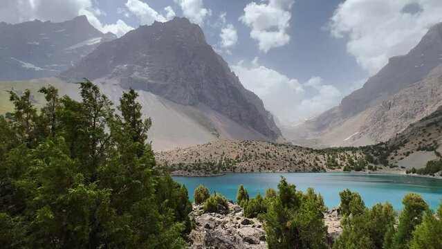 The Alaudin (Chapdara) lakes, lying at an altitude of 2800 m, are considered one of the most beautiful lakes of the Fan Mountains. Turquoise mountain lake. Pamiro-Alai. Tajikistan, Pamir 4K