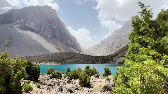 The Alaudin (Chapdara) lakes, lying at an altitude of 2800 m, are considered one of the most beautiful lakes of the Fan Mountains. Turquoise mountain lake. Pamiro-Alai. Tajikistan, Pamir 4K