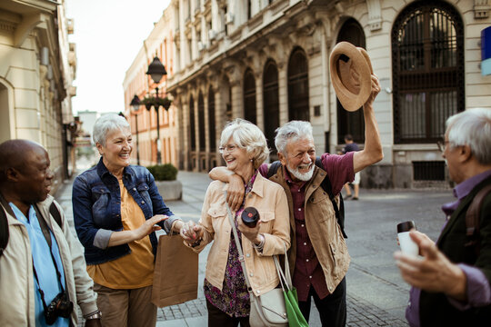 Diverse senior people having fun in city on vacation