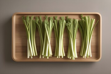 A bundle of crisp celery stalks with leaves attached