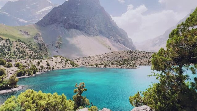 The Alaudin (Chapdara) lakes, lying at an altitude of 2800 m, are considered one of the most beautiful lakes of the Fan Mountains. Turquoise mountain lake. Pamiro-Alai. Tajikistan, Pamir 4K
