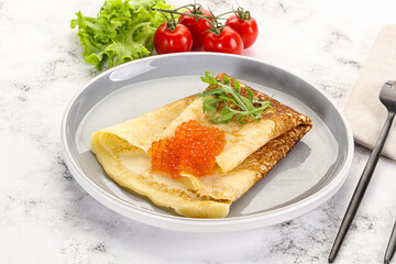 Russian pancake with red caviar