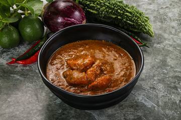 Indian cuisine - chicken curry with spices