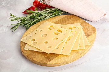 Sliced maasdam cheese with holes