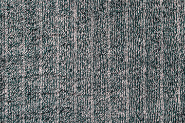 Dark green striped soft fabric background. Plush blanket
