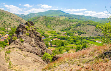 Fototapeta na wymiar View over the Valac stone to the village of Srbovac