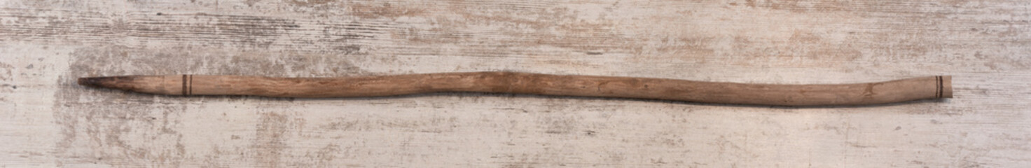 pointed stick isolated on wooden background