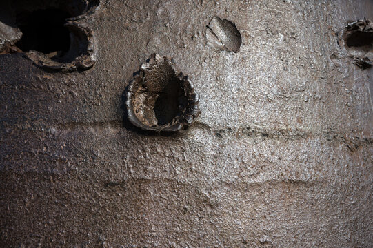 Detail of bullet and projectile holes in the armored bell-type defensive fortification.GFM Guetteur et Fusil-Mitrailleur cloche