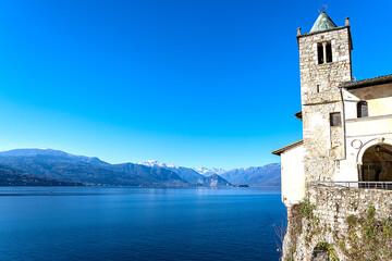 Panoramic view of Lake Maggiore with Isola Bella and Isola dei Pescatori, and on the right a view of the twelfth-century hermitage of Santa Caterina del Sasso with its bell tower