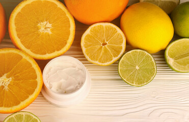 Cream with citrus extracts. Selective focus. Spa day, concept of freshness cream can with lemon lime and orange extract
