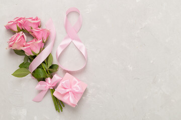 Composition with pink roses, gift box and eight made of ribbon on concrete background, top view. Women's day concept