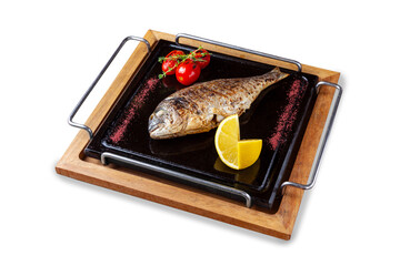 Fototapeta na wymiar Whole grilled dorado fish with tomatoes and lemon. Lunch. Isolated.