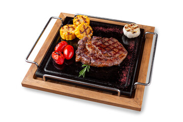 Grilled ribeye steak with tomatoes and corn. Lunch. Isolated.