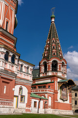 A fragment of St. Basil's Cathedral against the blue sky.