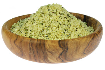 hemp seeds in an olive wood bowl isolated on white background