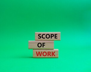 Scope of Work symbol. Concept words Scope of Work on wooden blocks. Beautiful green background. Business and Scope of Work concept. Copy space.