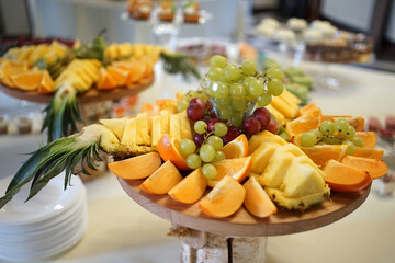 Fruit table. Grapes, pineapples, oranges, apples and others.