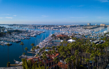Aerial view of the marina, California Yacht Club, palm trees, sailboats, and Pacific Ocean in...