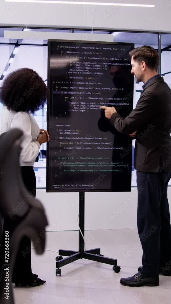 Sticker programmer team meeting with tv screen in office