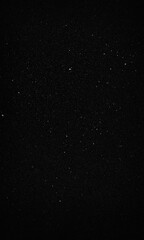 Fototapeta premium Snow overlay texture against black background