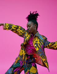 black woman dancing in pink bakground