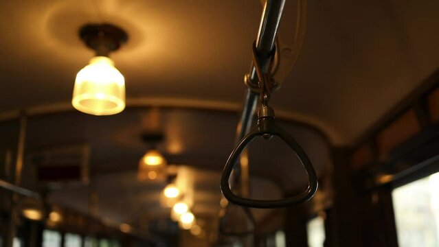 Orange lights in an old tram in Milan City. Vintage lamps. High quality FullHD footage