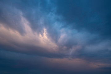 Dramatic pastel colored clouds at sunset