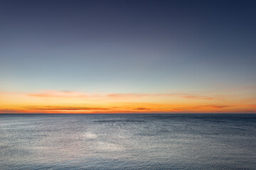 Sunrise on sea golden blue colors