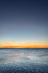 Fototapeta premium Sunrise on sea golden blue colors